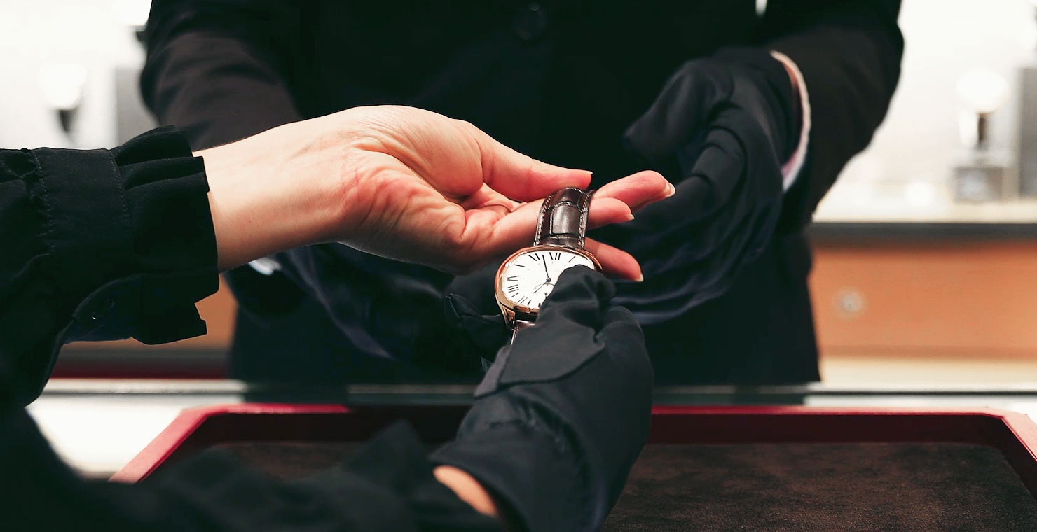 Customer Admiring Luxury Watches 2