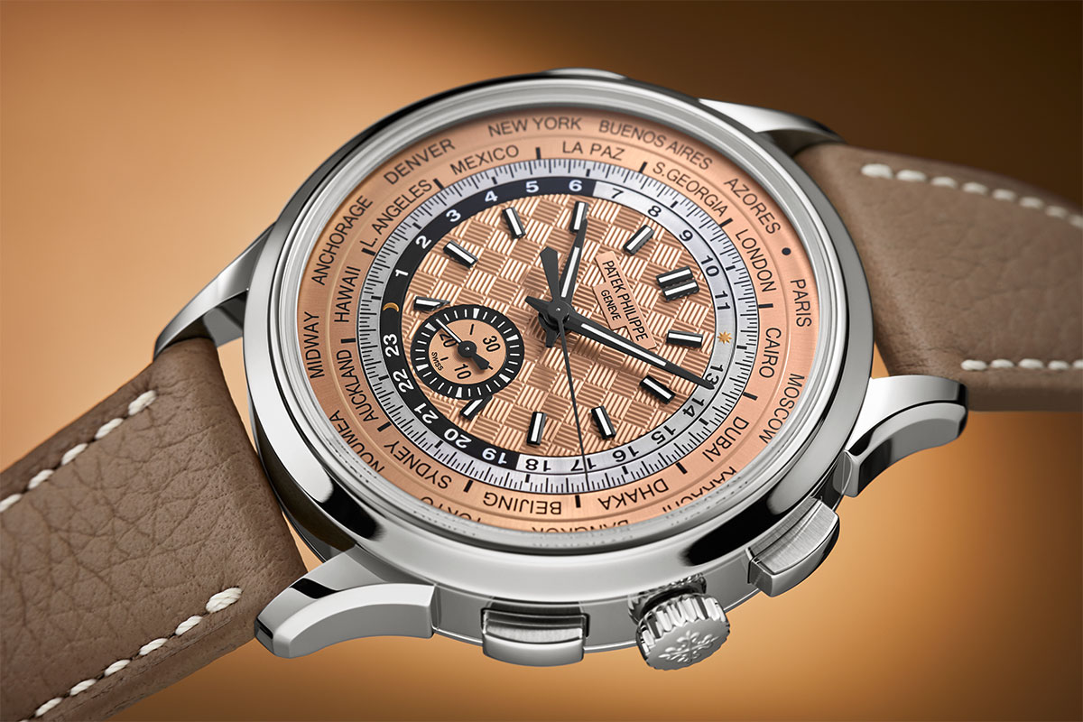 The Patek Philippe Ref. 5935A-001 World Time with Flyback Chronograph in stainless steel case and rose-gilt dial with carbon motif design. | Cortina Watch