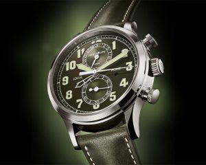 The Patek Philippe Ref. 5924G-010 Calatrava Pilot Travel Time Chronograph in white gold case with green dial.