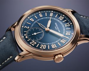 The Patek Philippe Ref. 5224R Calatrava 24-Hour Display Travel Time indicates day time on the upper half of the dial and night time on the opposite side.