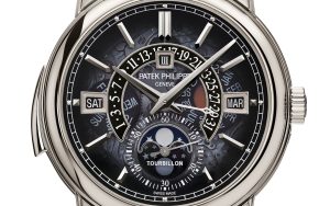 The blue metallised sapphire crystal of the Patek Philippe Ref. 5316/50P-001 partially reveals the workings of the perpetual calendar complication displayed on the dial.