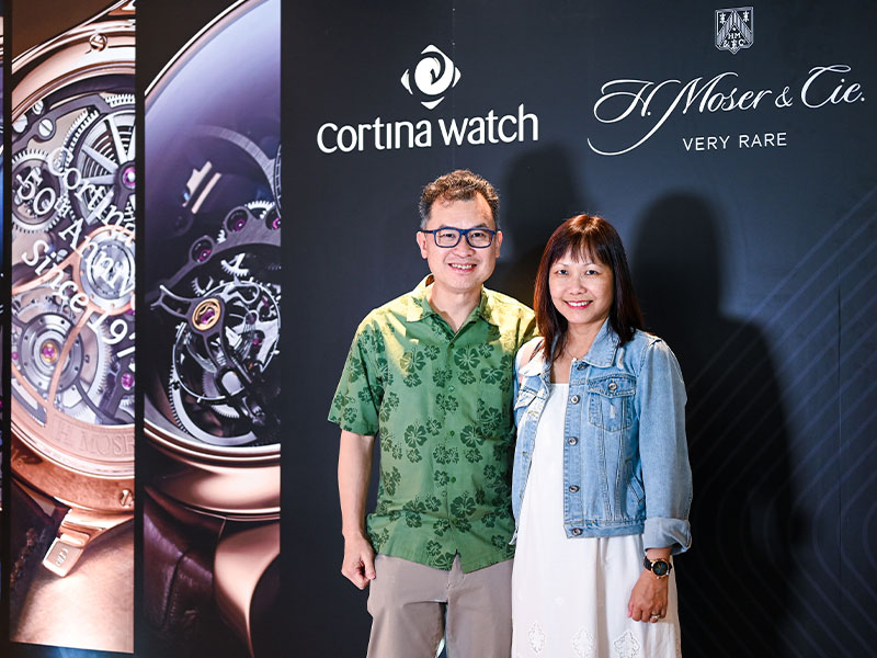 Couple Posing For Photo During Cortina Watch And H Moser Cie Cocktail Party