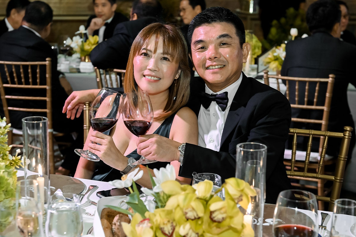 Two Guests Posing For Photo At Patek Philippe Gala Dinner